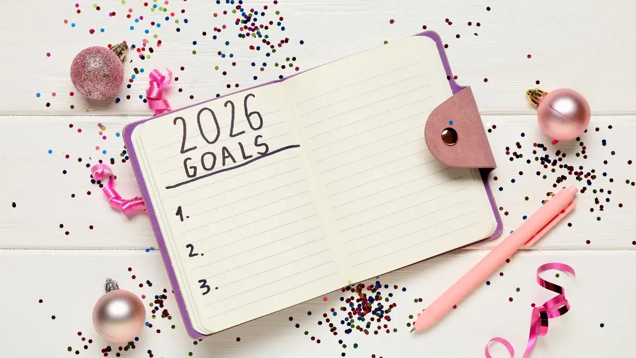Open journal with 2026 goals written inside, representing intentional goal setting and planning for the new year