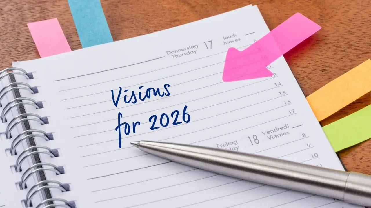 Notebook page with handwritten text “Visions for 2026,” representing intentional planning and future goal setting
